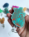 Heart Badge Reel - Teal & Red