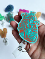 Heart Badge Reel - Teal & Red