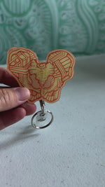 Pelvis Badge Reel - Yellow & Orange